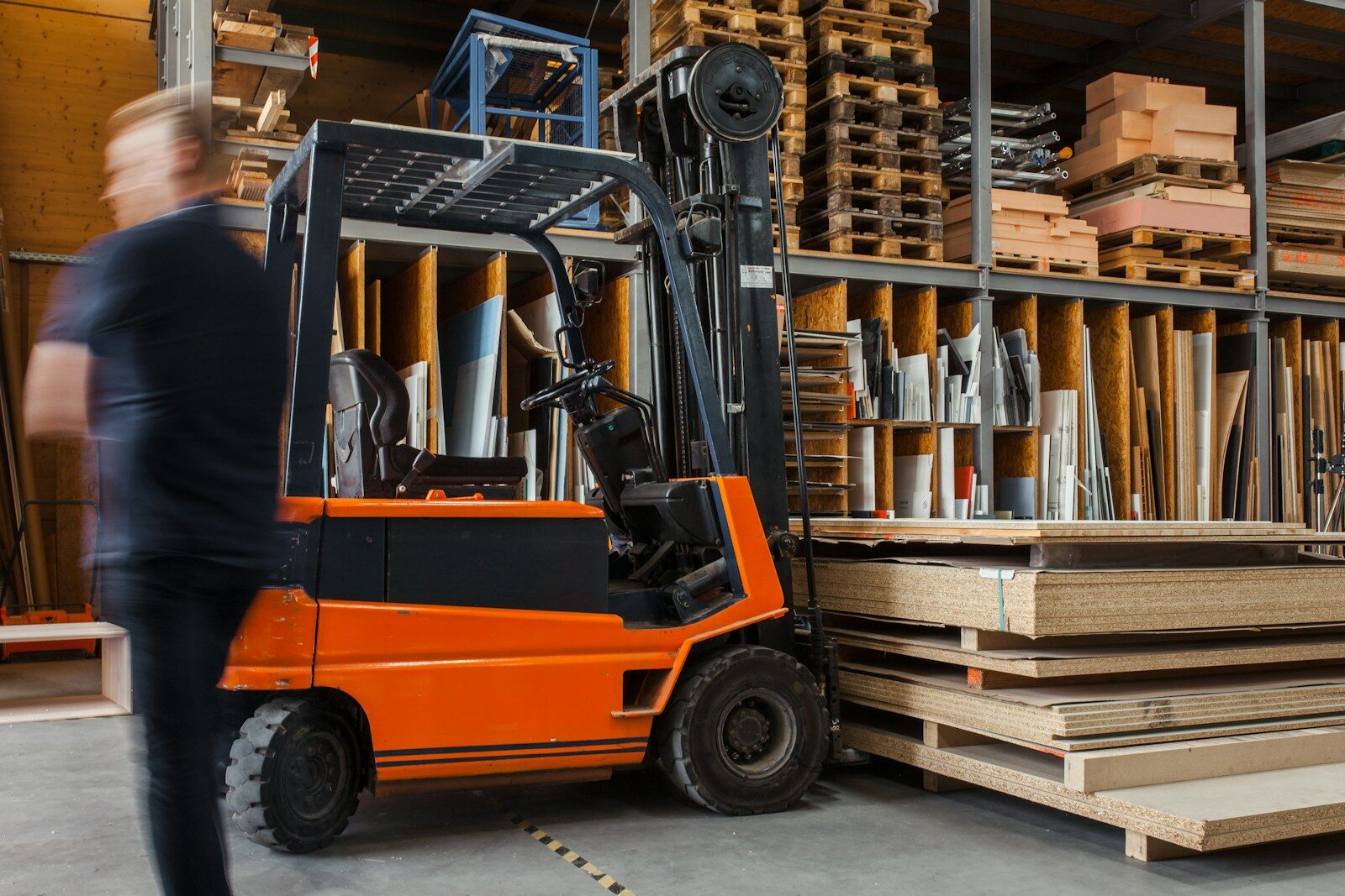 brown cardboard boxes on white metal rack